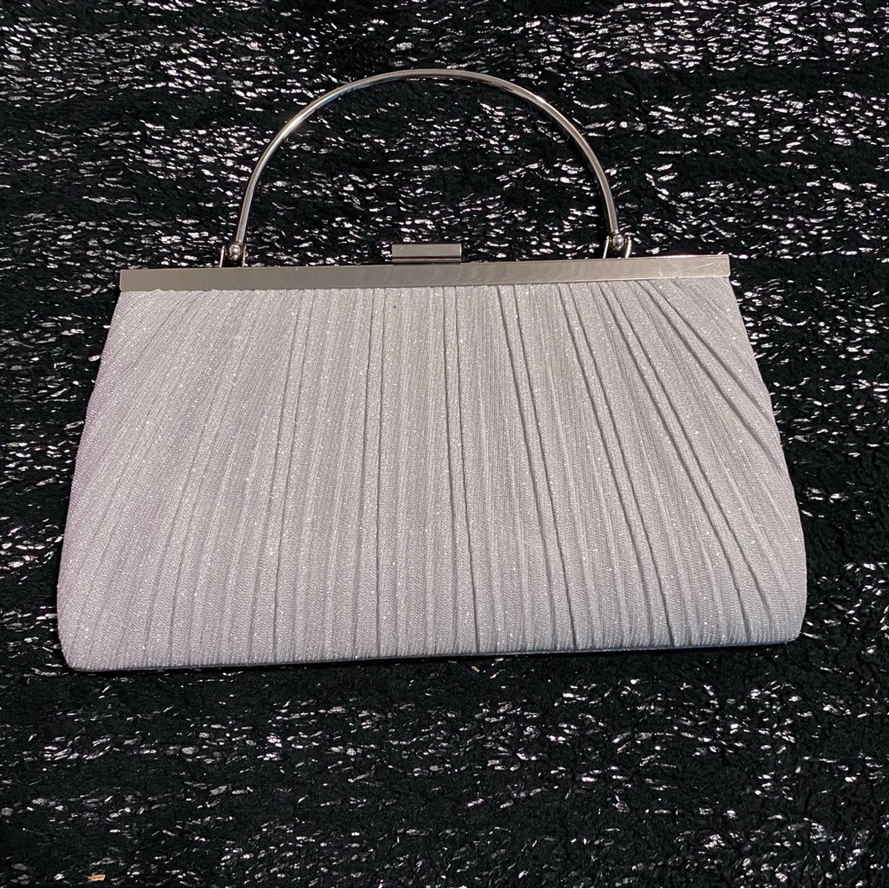 Silver glittery clutch bag with long strap